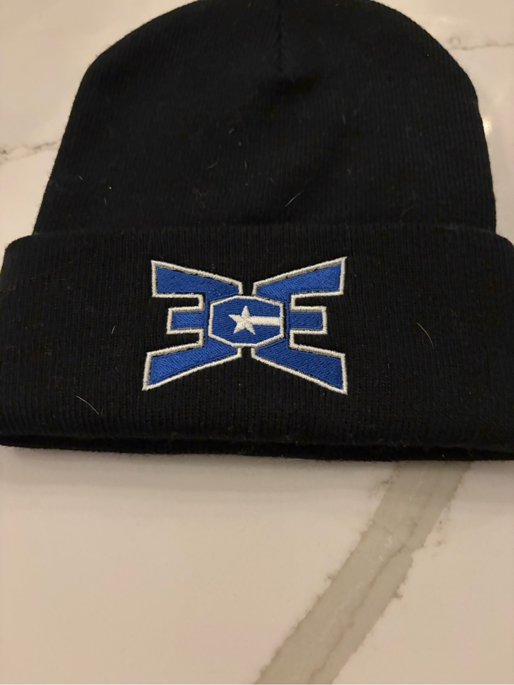 East celebrity elite Black Beanie Hat with Blue Star Logo